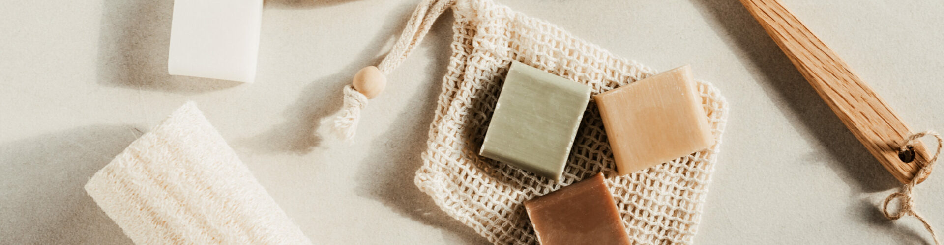 Handmade natural bar soaps. Ethical, sustainable zero waste lifestyle. DIY, hobby, artisan small business idea. Top view, mockup